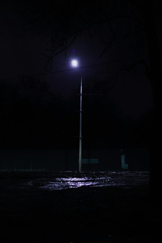 Street Lighting for LGUs and Infrastructure Projects: A Procurement Specification Guide LED street light on a pole at night for LGU roadway lighting procurement